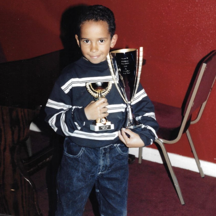 I was 6 years old here when I earned my first two trophies remote control car racing. The small trophy was 2nd place in the electric class championship, against grown men. The bigger was for best new comer in the bigger petrol cars again against men. I was the youngest by at least 15 years. We were also the only people of colour there in a much smaller field. I was so proud, these were some the best days of my life spending time with my dad out the back of the old car we had with our pot noodle soup and bacon sandwiches which was very much an English thing.